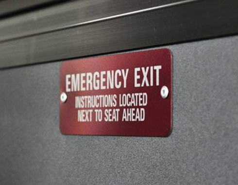 Anodized aluminum transit vehicle emergency exit plate